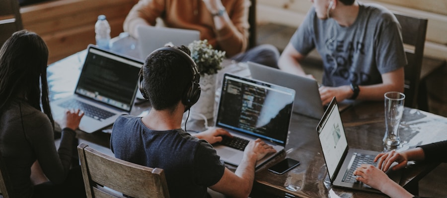 Startup team working with laptops in a modern coworking space